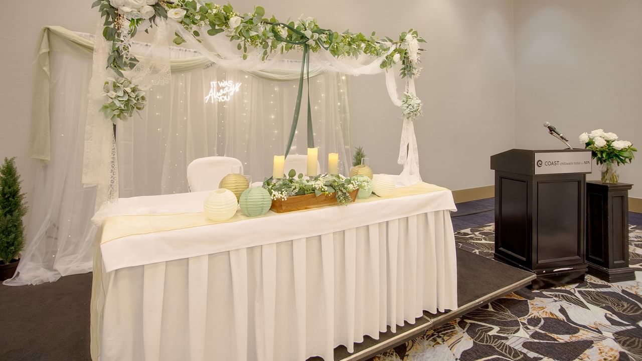 Decorated table with candles and flowers for a wedding.