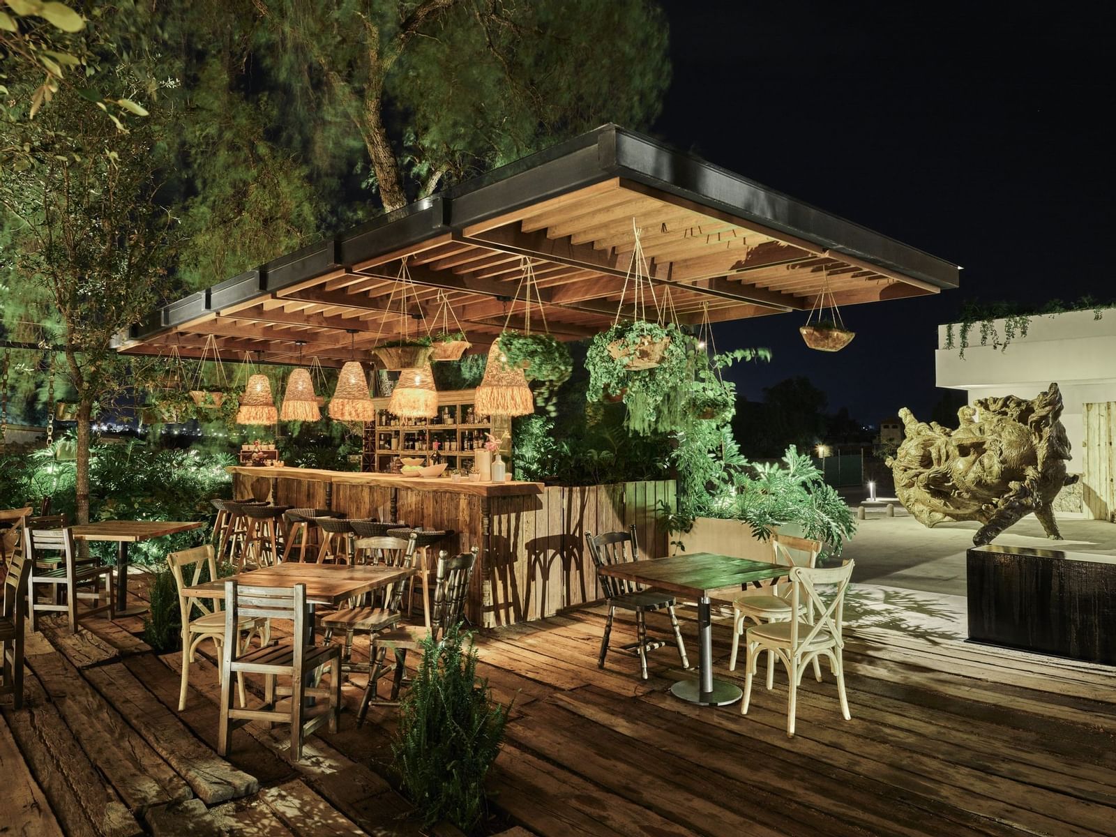 Yintony outdoor bar on a green, wooden terrace at La Colección