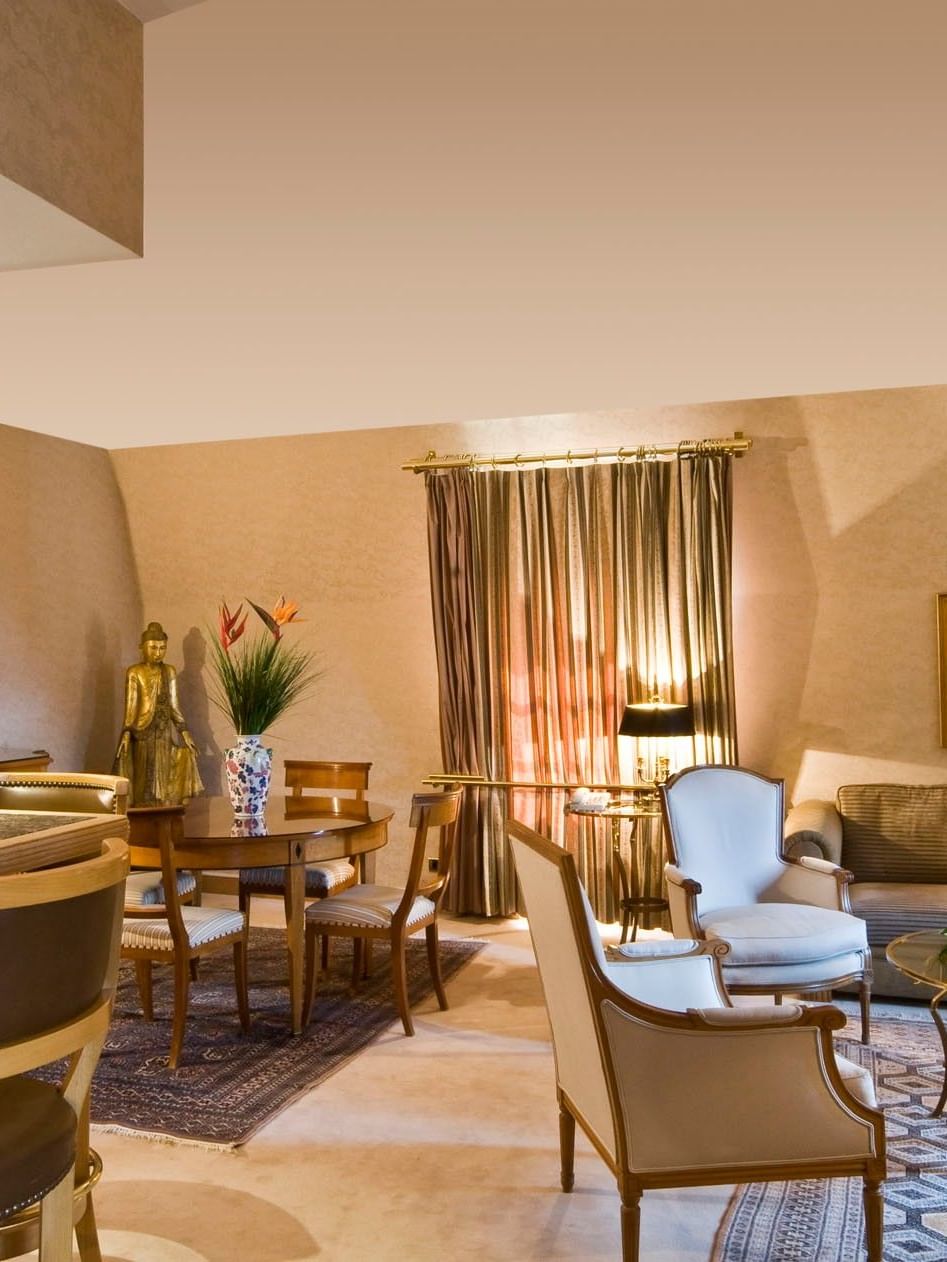 Royal Suite living area with plush sofa near dining table at Warwick Grand Place Brussels