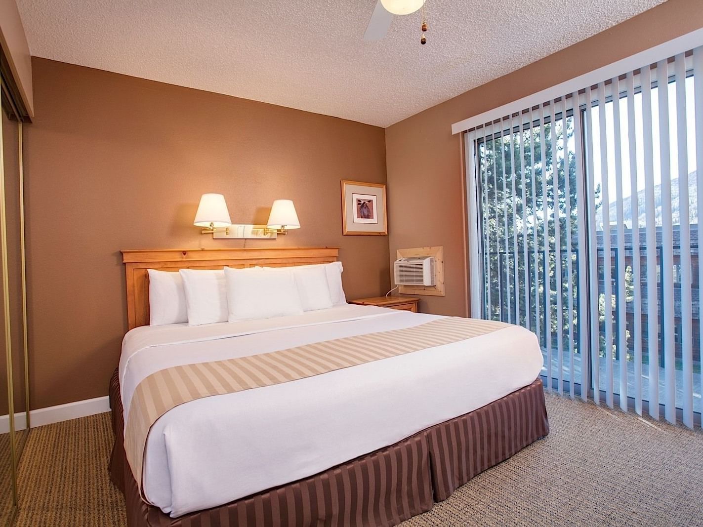 Large bed, One bedroom suite at Legacy Vacation Resorts