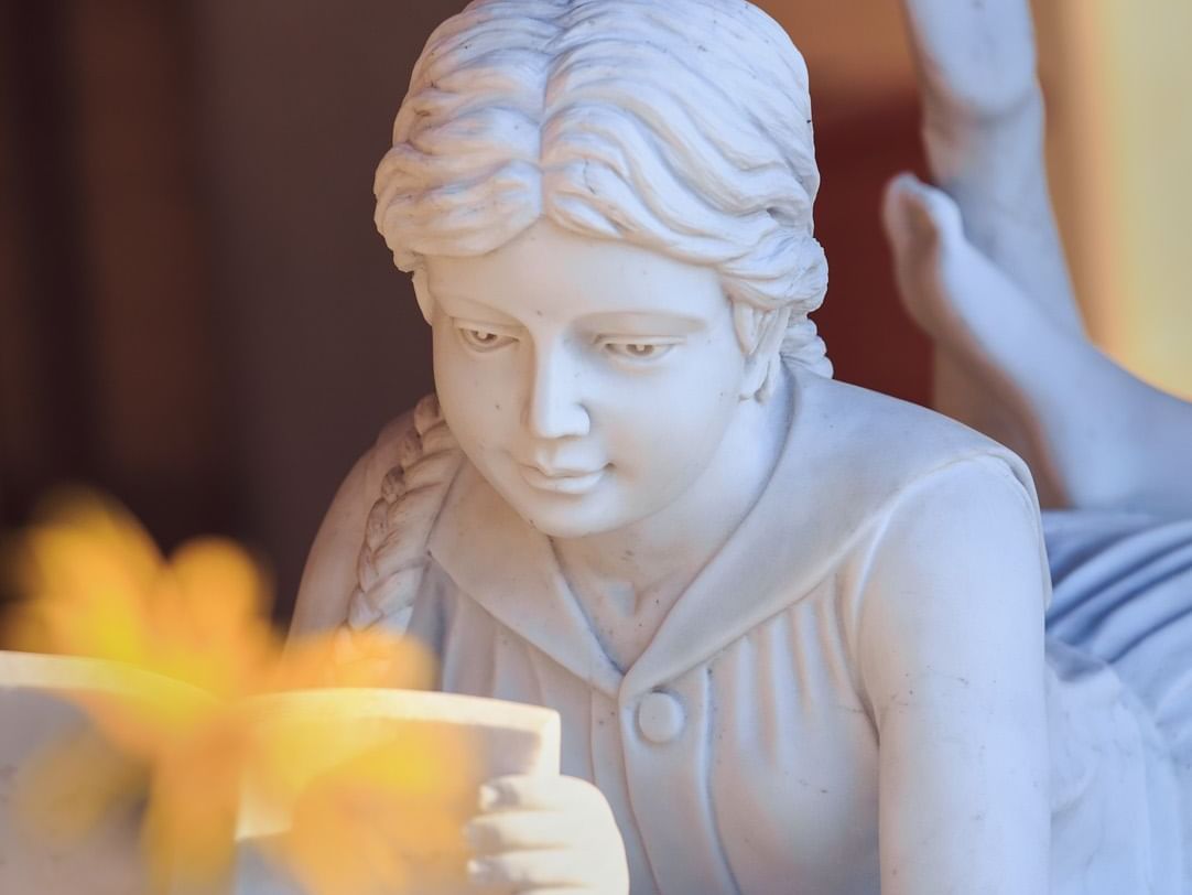 Sculpture of girl  reading