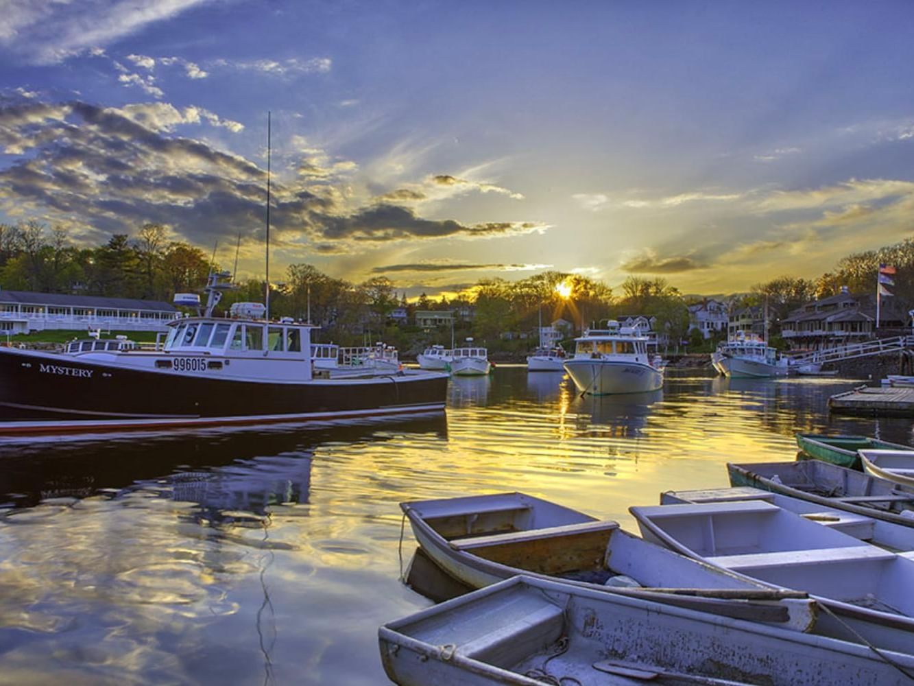 Scenic view of boats docked at a harbor during sunset near Meadowmere Resort