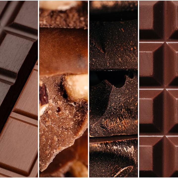 Collection of milk and dark chocolate bars with different textures and nut fillings at Warwick Grand Place Brussels