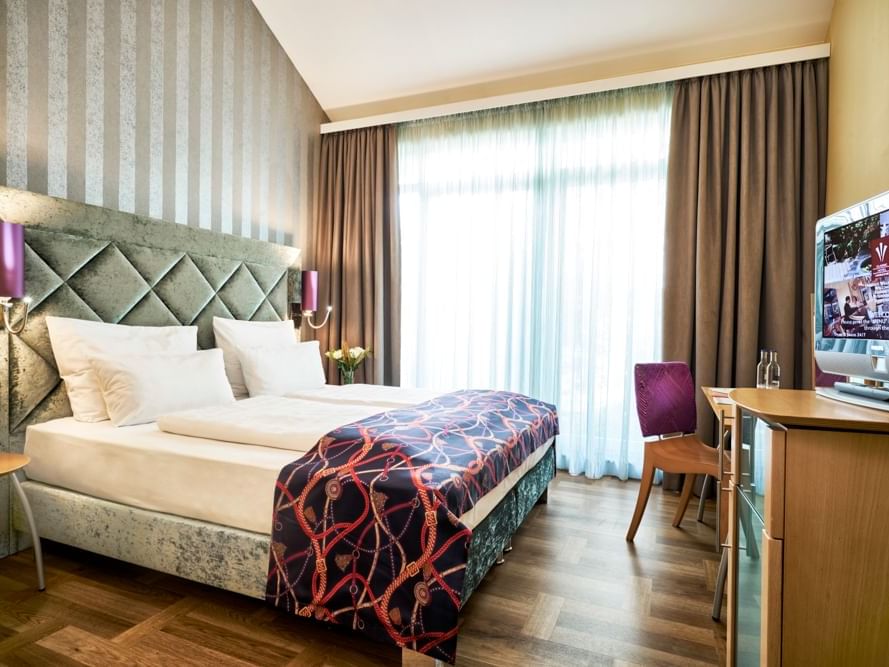 TV ,King bed in Superior Double Room at Classic Hotel Harmonie