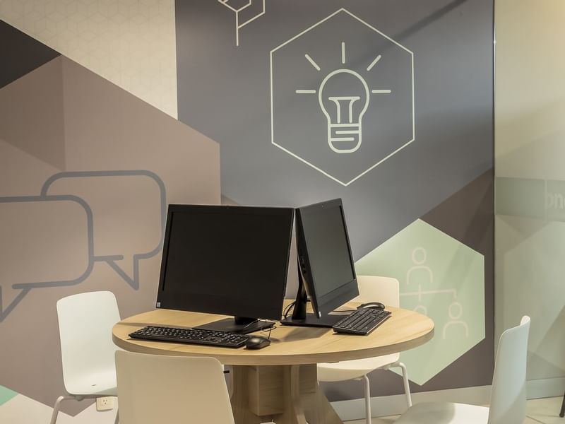 Close-up of workstations in the Business Center at One Hotels