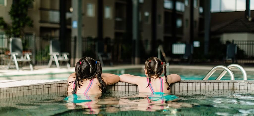 Two children in an indoor hotel pool in Kamloops
