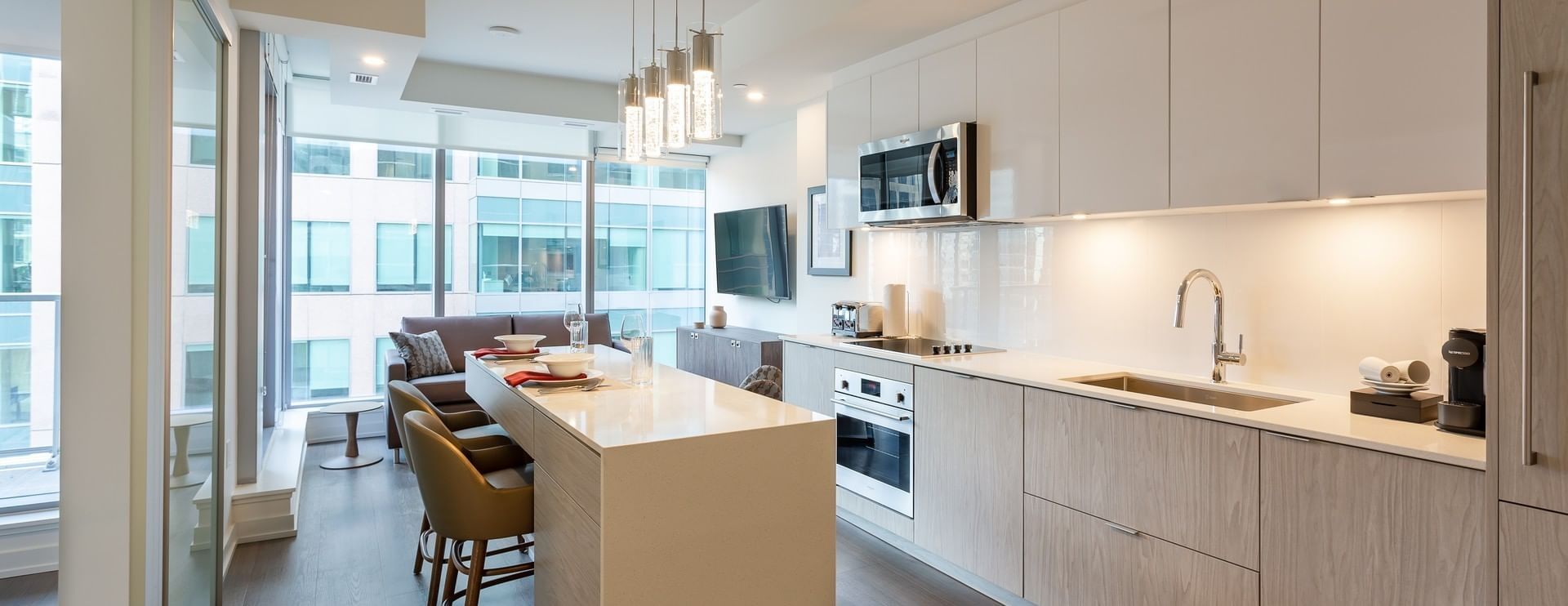 Kitchen with an island & city view at ReStays Ottawa