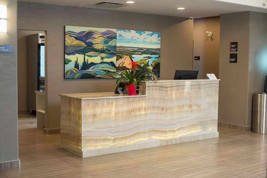 Reception area with front desk at Encore Suites Grande Prairie