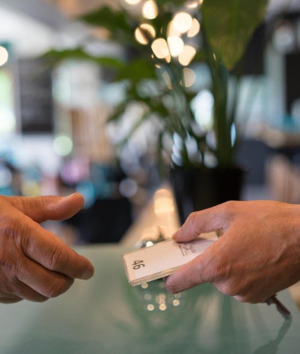 Close-up of handing over guest room card, The Originals Hotels