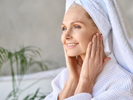 A lady posing in a bathrobe at Ana Hotels Europa Eforie Nord