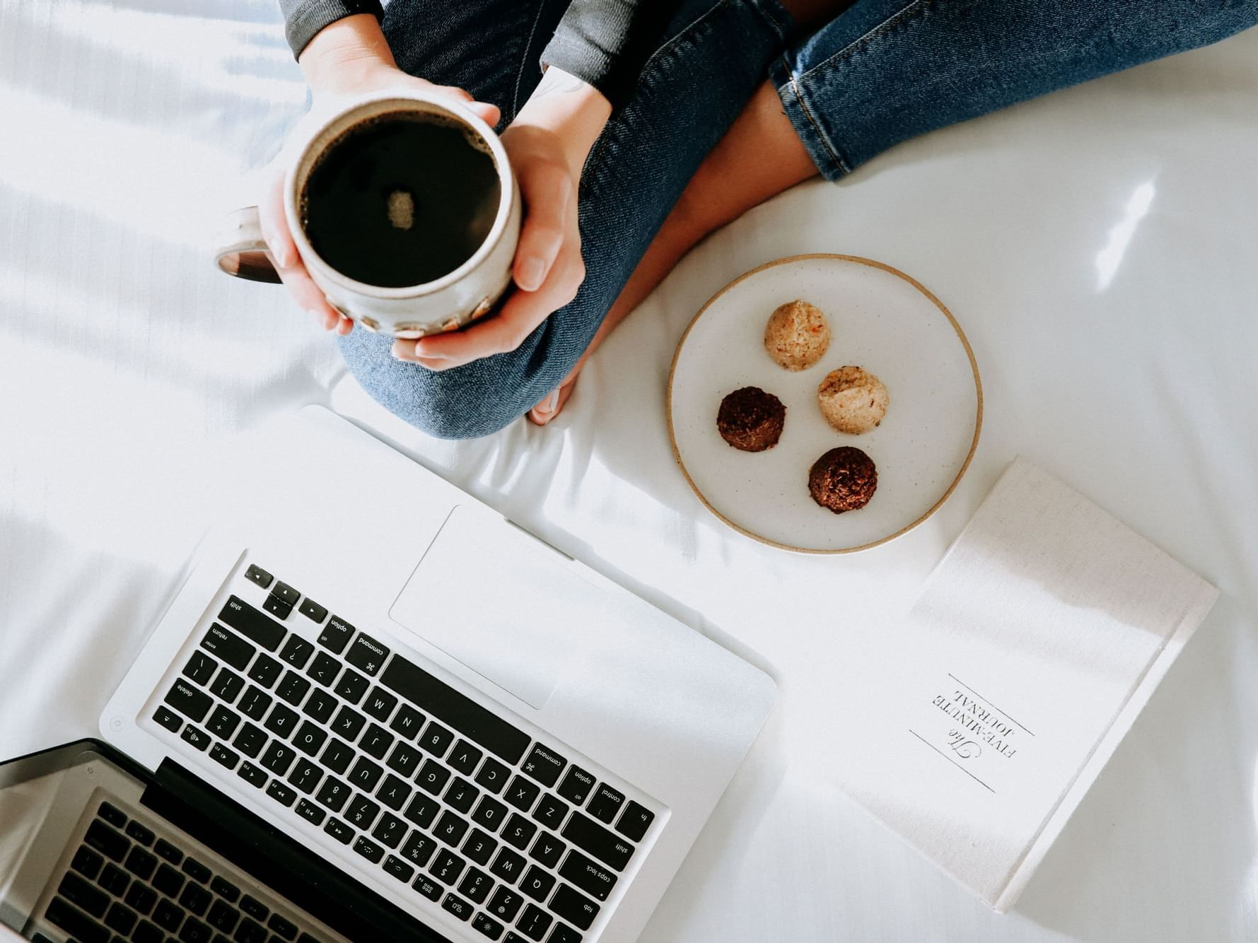 Close photo of coffee and laptop.