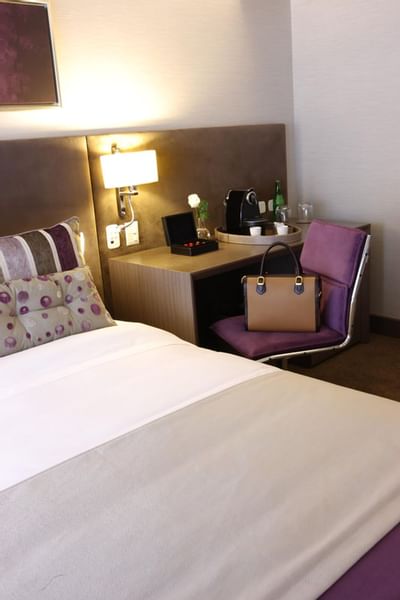Bed & furniture in Deluxe Suite at Recoleta Grand Hotel