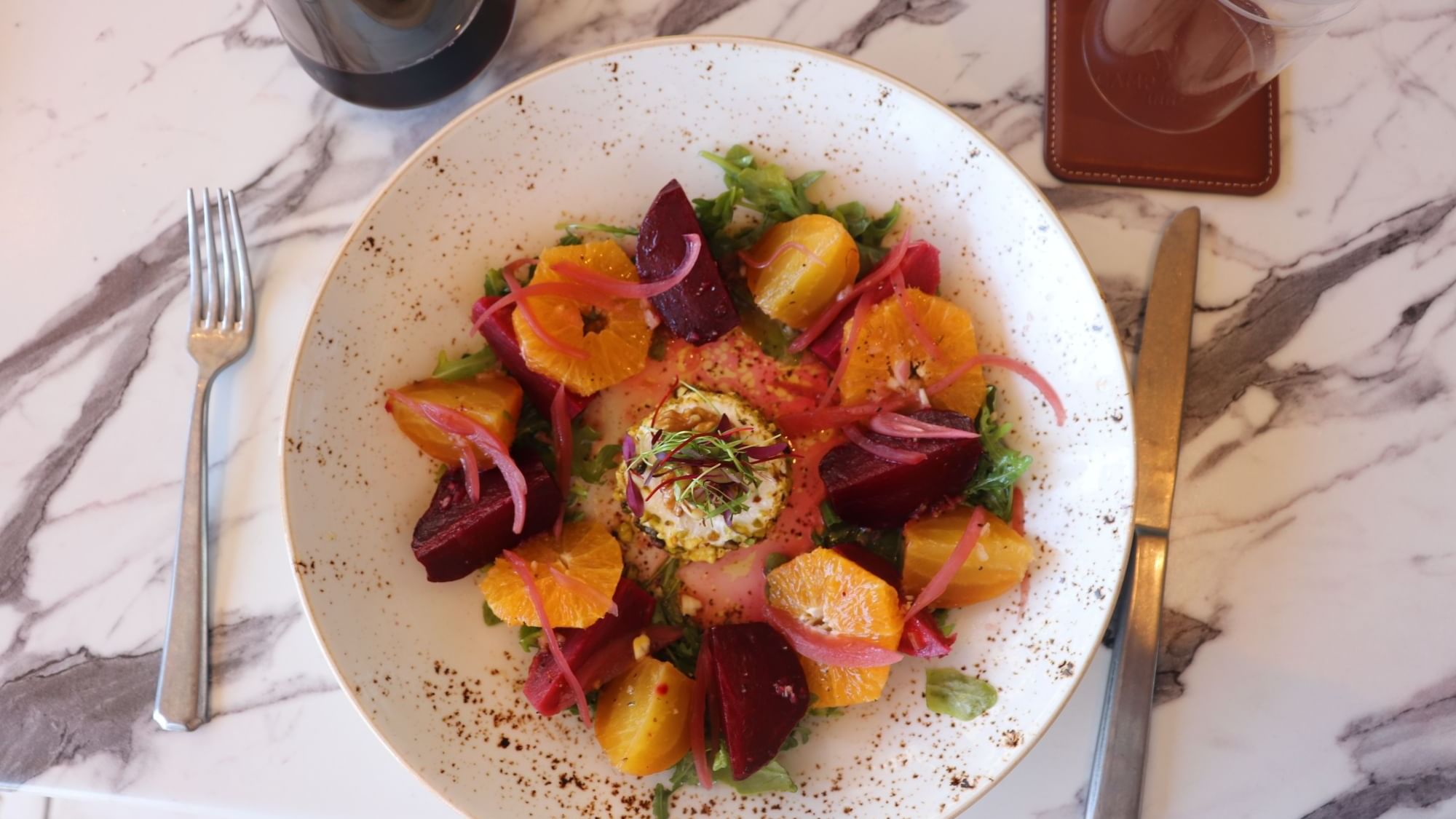 Roasted beet salad with oranges served on a plate in 1936 at Camp Creek Inn