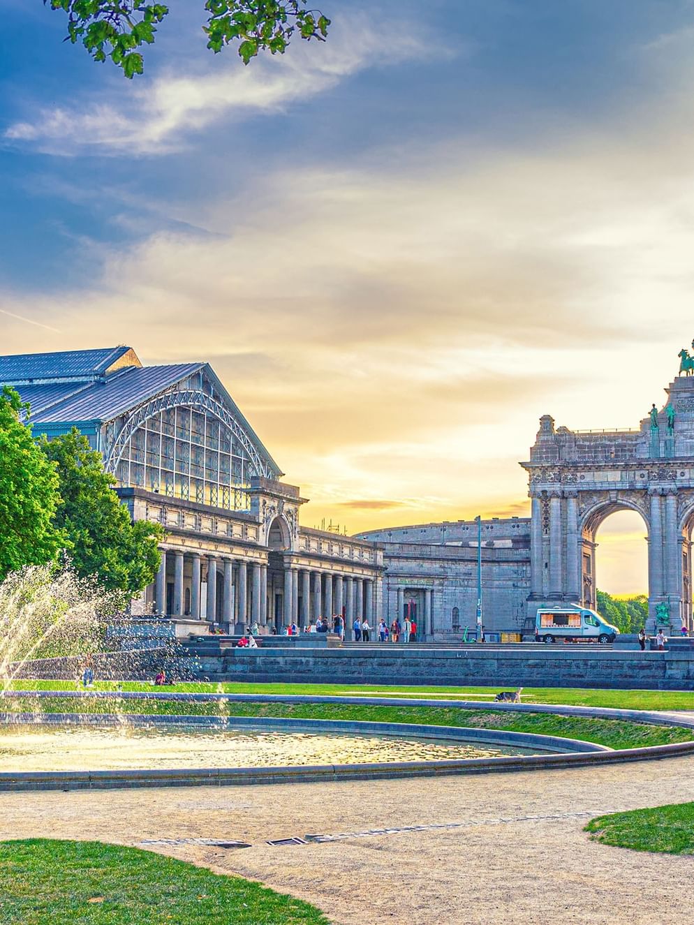 Scenic view of the Cinquantenaire Arch and fountain at sunset near Hotel Barsey by Warwick