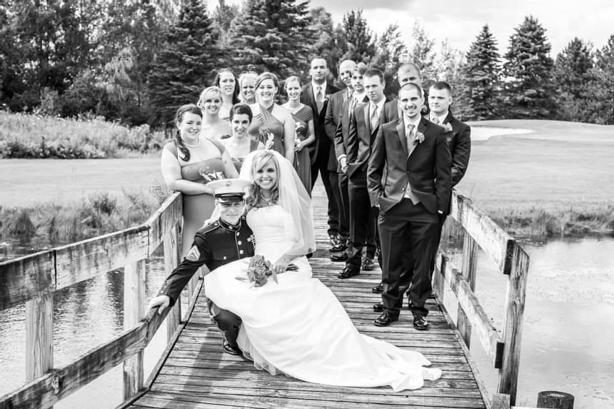 Bridle party posing on the bridge at Evergreen Resort