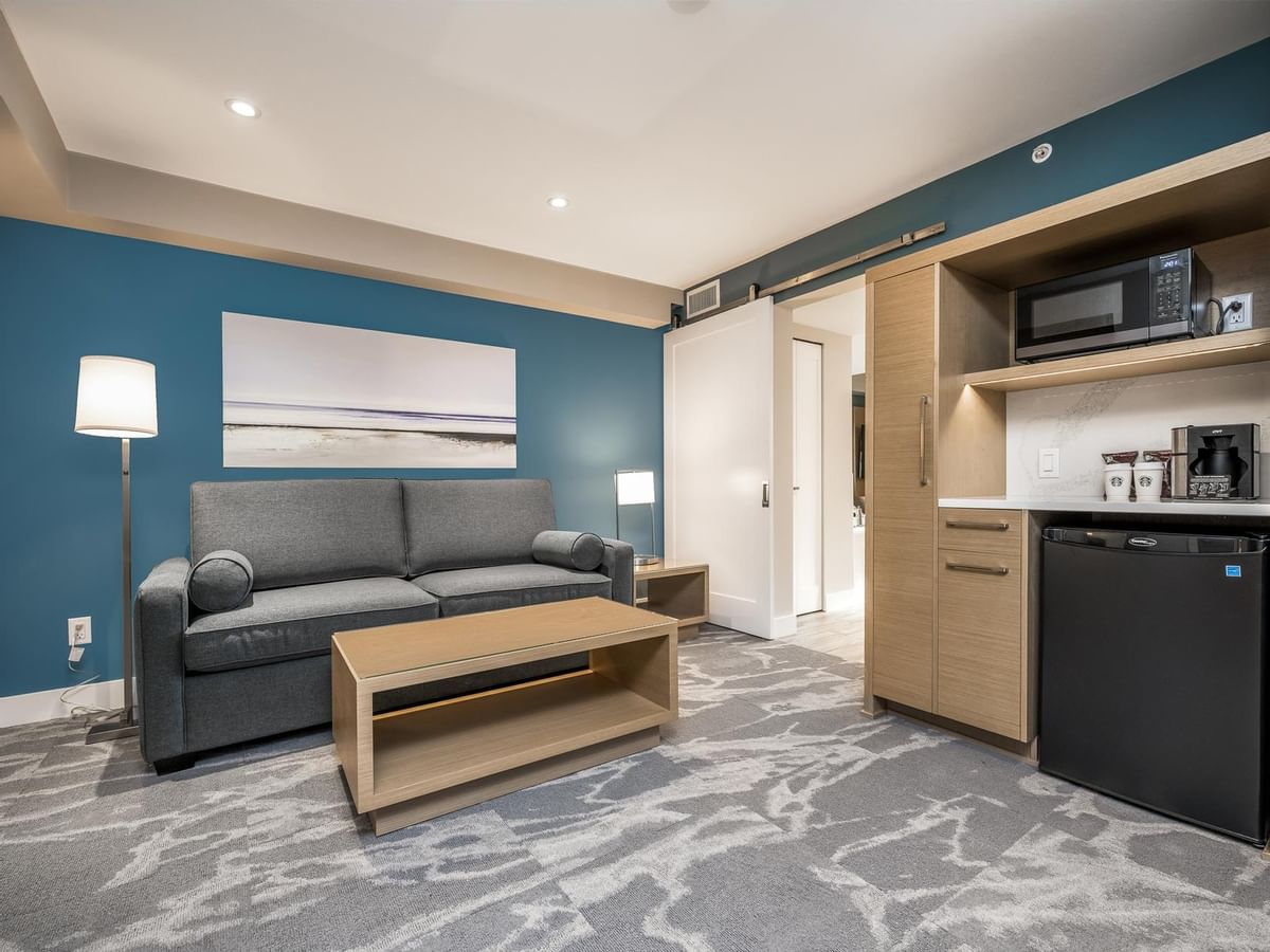 Living room and kitchenette area in our Coast Premium King Suite with Jetted Tub