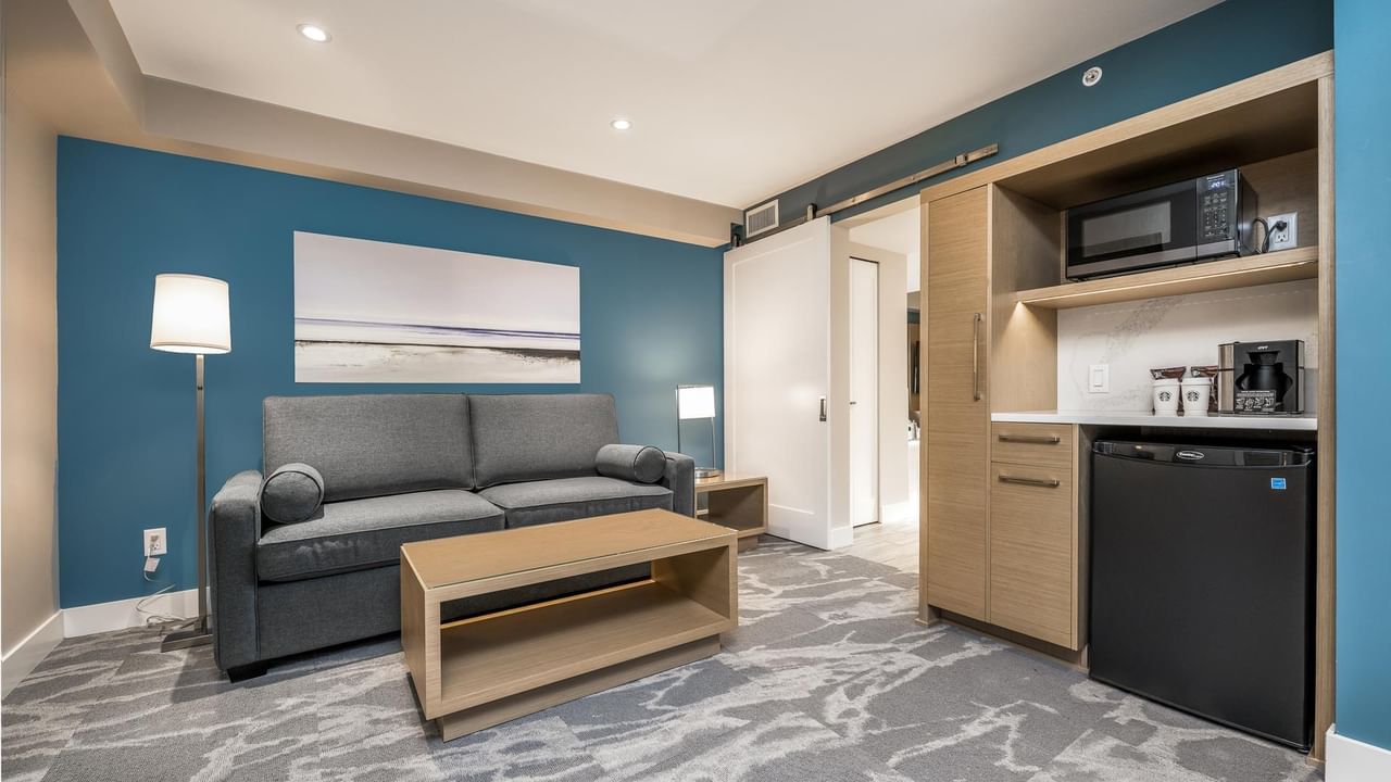 Living room and kitchenette area in our Coast Premium King Suite with Jetted Tub