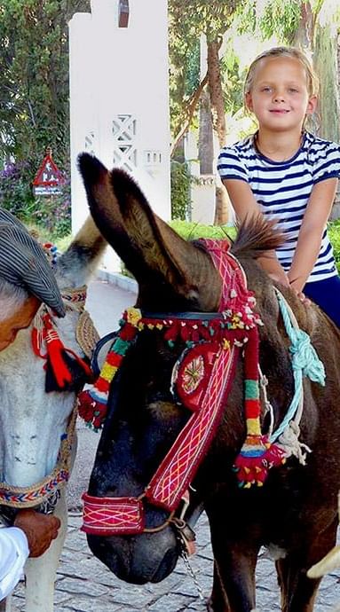 Closeup of a Kid seated on a pony at Marbella Club in 2010