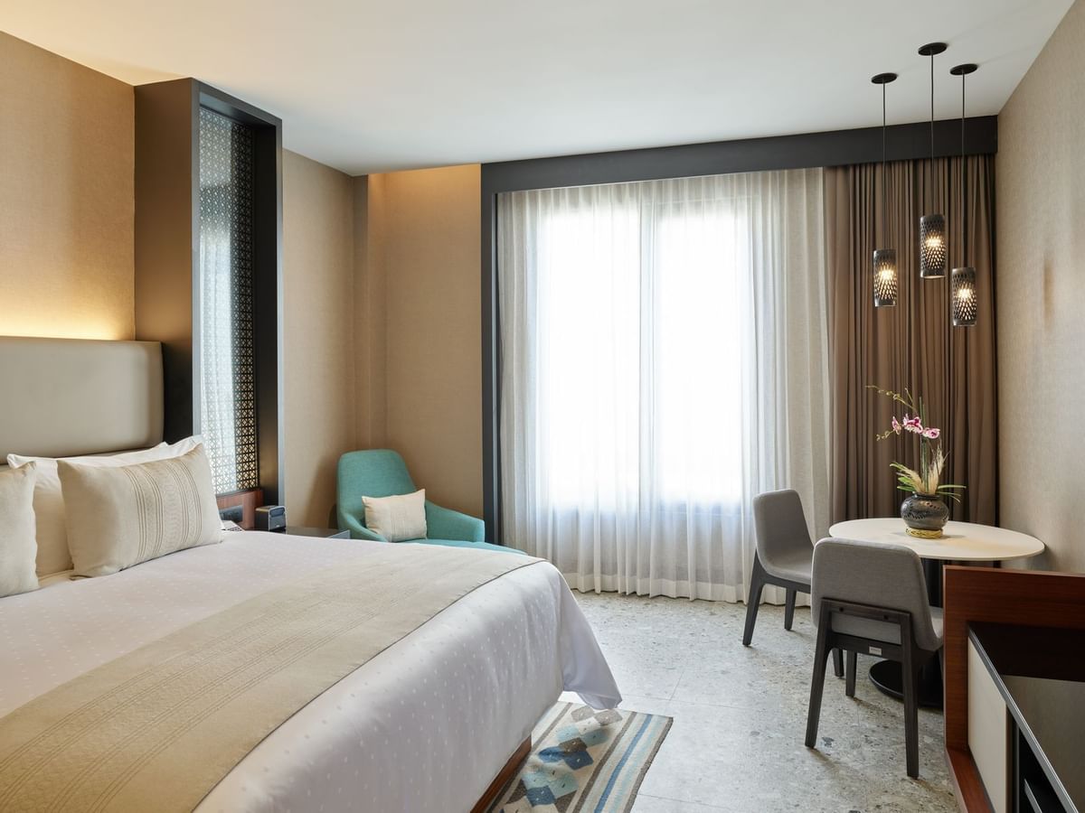 Deluxe Room with king bed & furniture at Grand Fiesta Americana