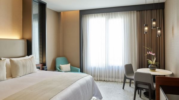 Deluxe Room with king bed & furniture at Grand Fiesta Americana