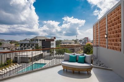 Sofa on the balcony area in Suite at Eastin Ashta Resort Canggu