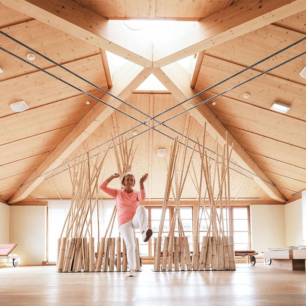 Person doing yoga in ACQUAPURA SPA at Falkensteiner Hotel Cristallo