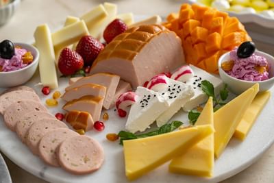 Close-up of cheese with fruits platter at Elaf Al Taqwa Hotel