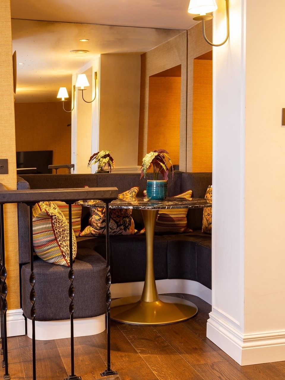Corner dining nook with marble table & mirror wall in Hyde Park Suite at The Capital Hotel, Apartments and Townhouse