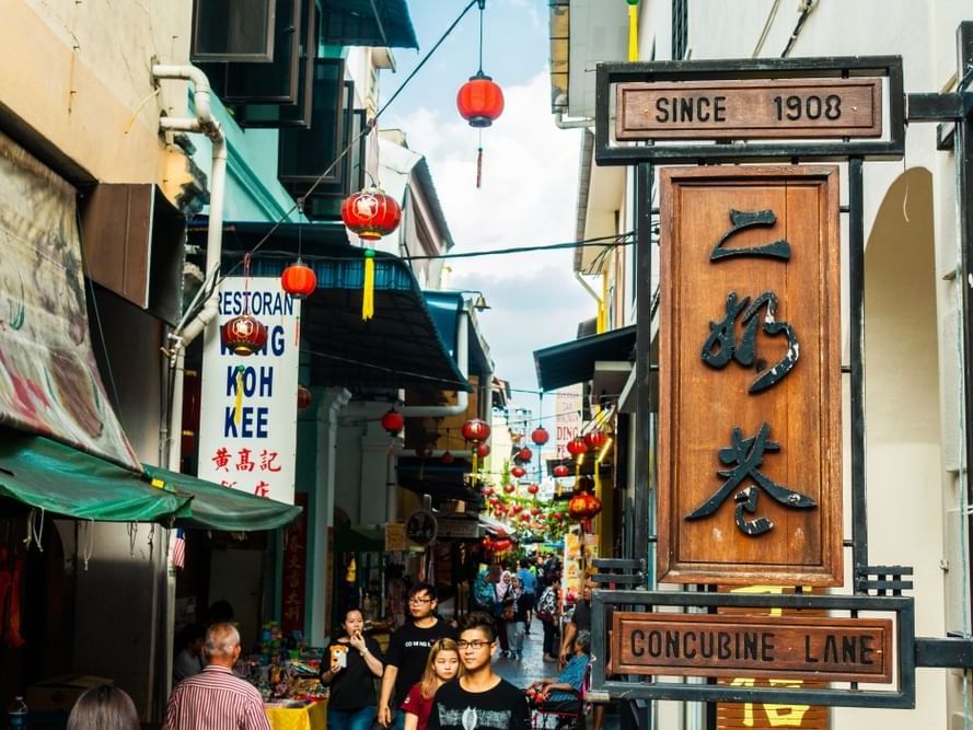 Concubine Lane sign reading and vibrant alley with hanging red lanterns near Cititel Express Ipoh