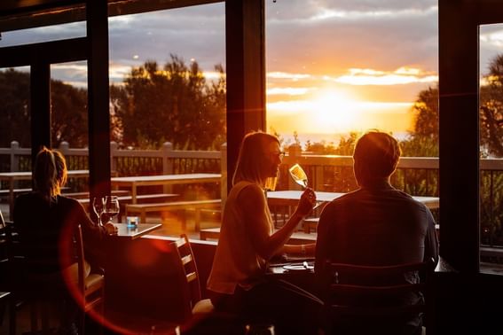 Couple having a chat at The Bay Restaurant in Freycinet Lodge