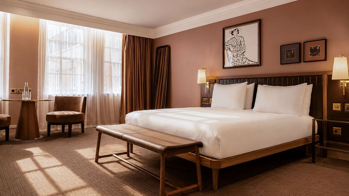 Collection Superior Room with king bed, warm terracotta walls, and view at The May Fair Hotel, London, England