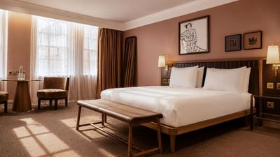 Collection Superior Room with king bed, warm terracotta walls, and view at The May Fair Hotel, London, England