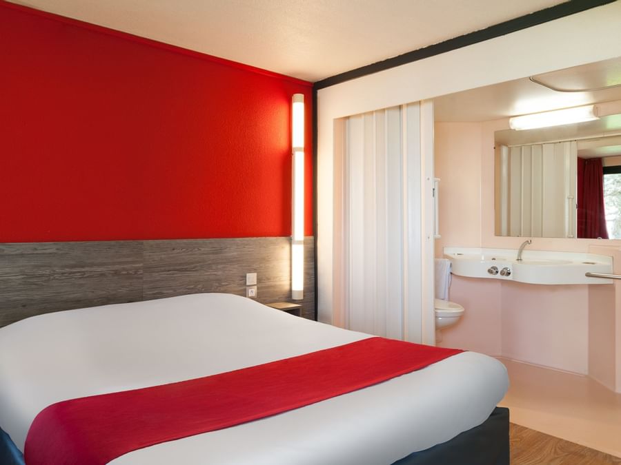 A view of a Triple bed PMR Room at The Originals Hotels