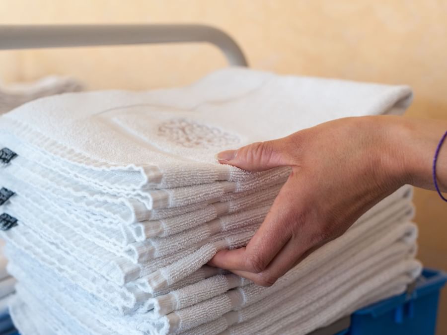 Stacked towels in a trolley at Hotel La Saulaie