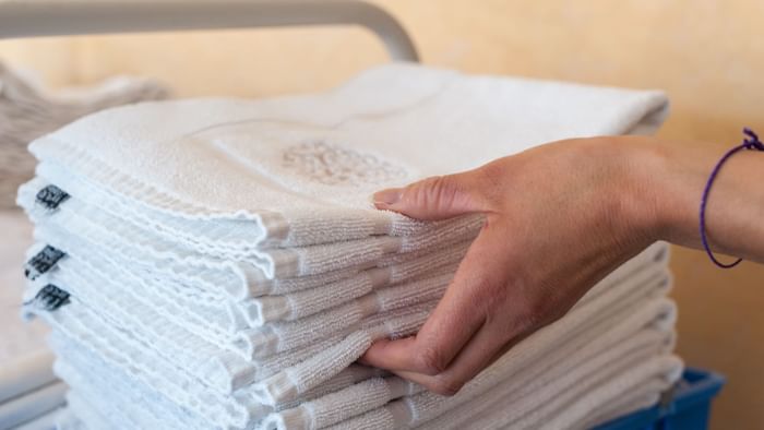 Stacked towels in a trolley at Hotel La Saulaie