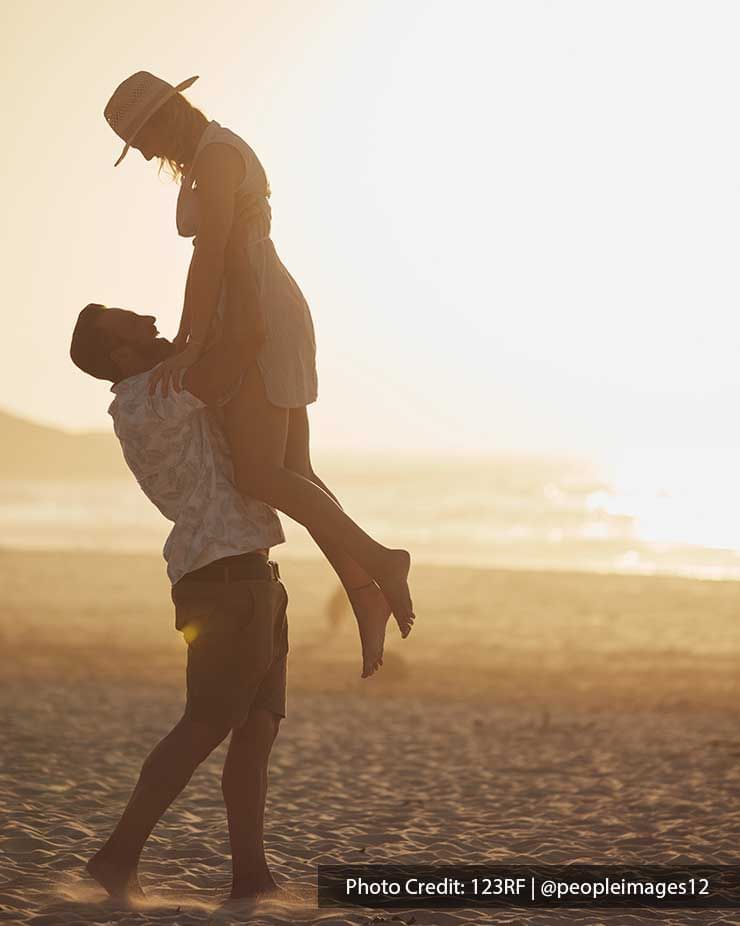 lovely couple spending time on the beach under the sunset - Grand Lexis PD