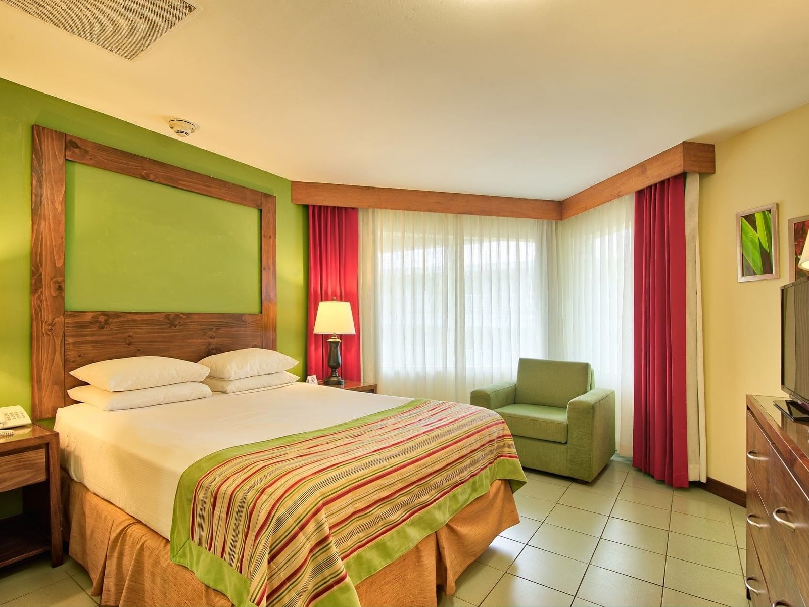 Beautiful family one queen bed with green decoration at Fiesta Resort 