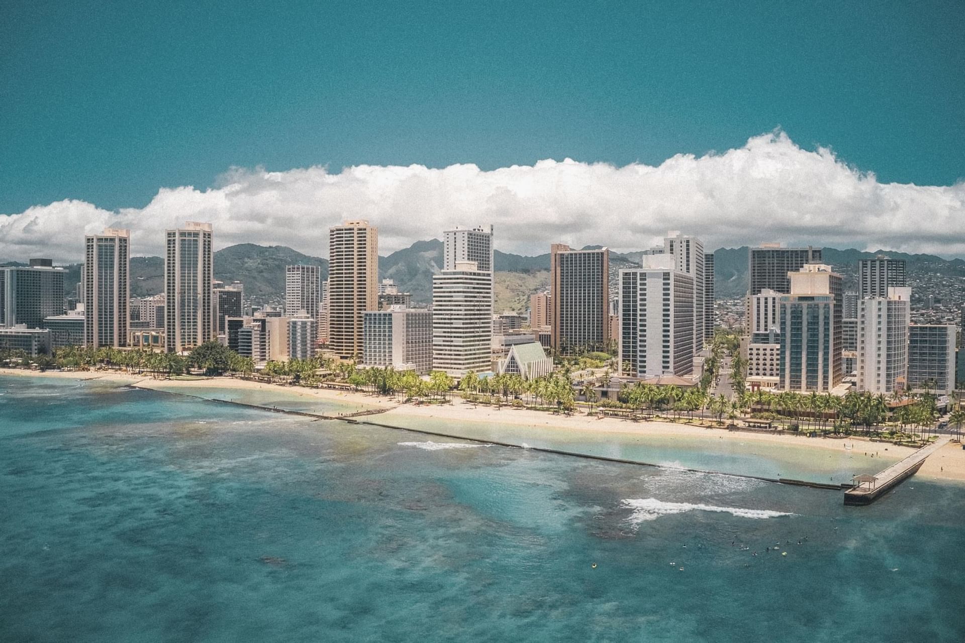 Aerial view of the beach and city near Waikiki Resort Hotel by Sono