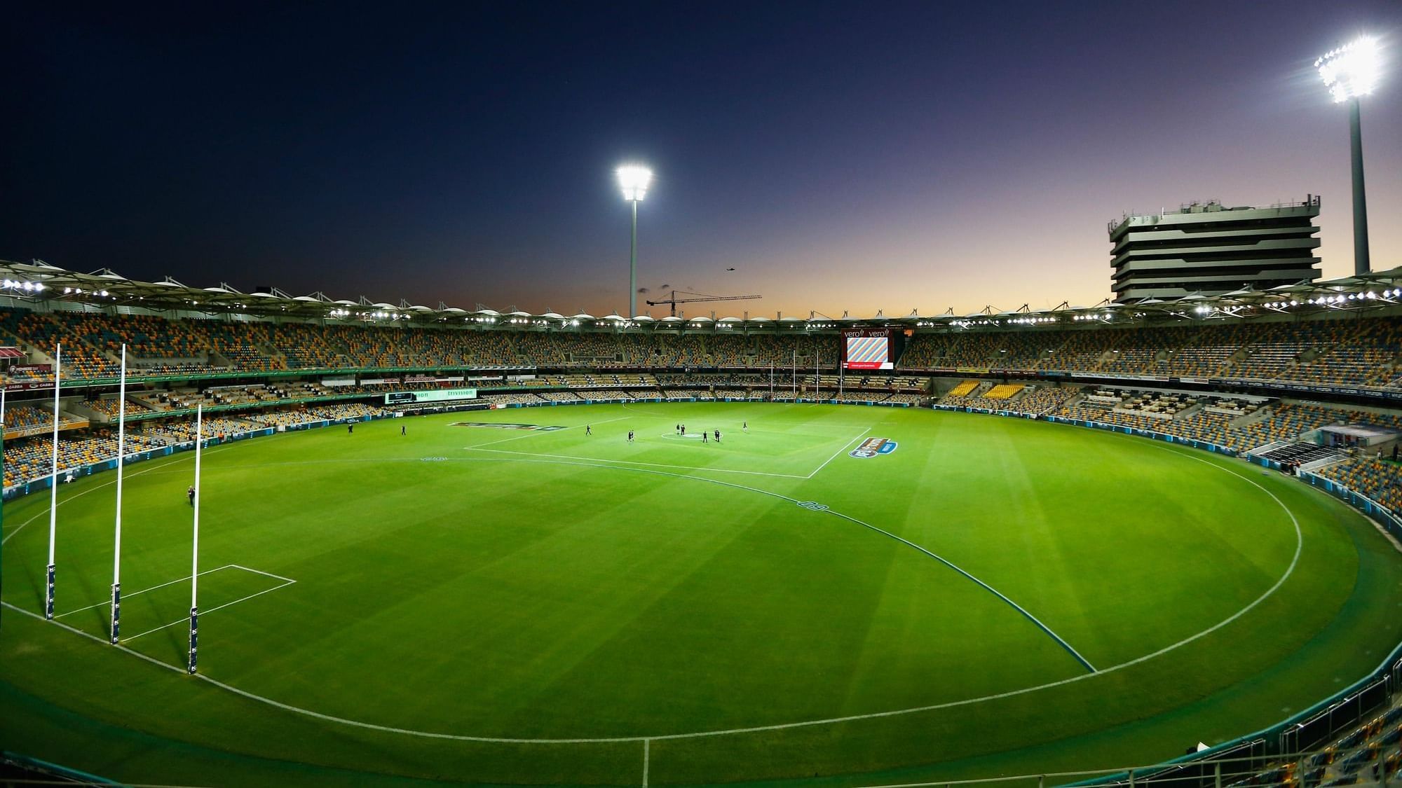 Twilight view of The Gabba with lit floodlights and a clear sky naerSofitel Brisbane Central