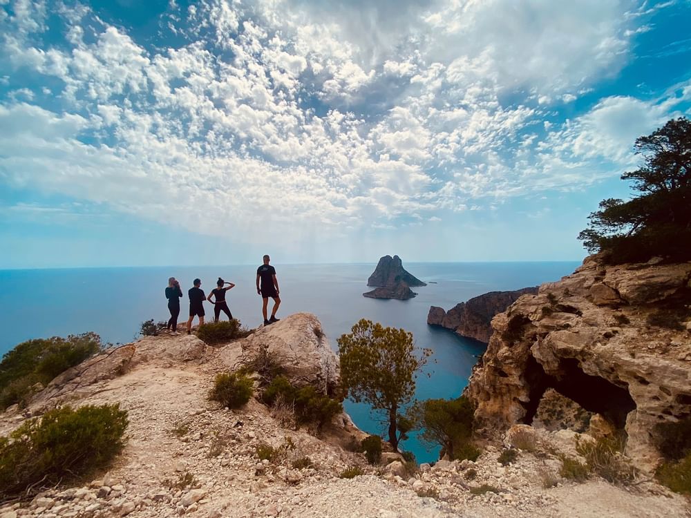 Hiking group in Ibiza looking at Es Vedra