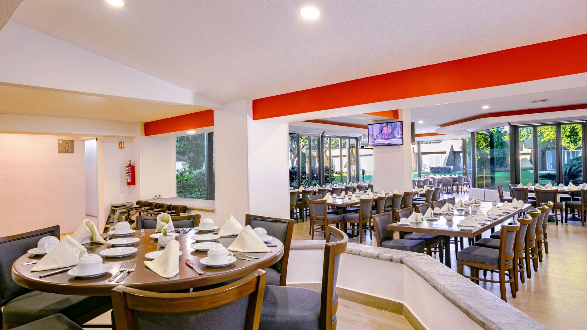 Elegant dining area with multiple tables and chairs at La Huerta in Zapopan at Camino Real Guadalajara