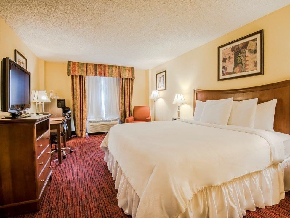 The Dallas Deluxe King with king bed at MCM Elegante Suites