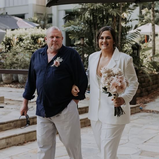 Wedding couple posing at Pullman Palm Cove Sea Temple Resort