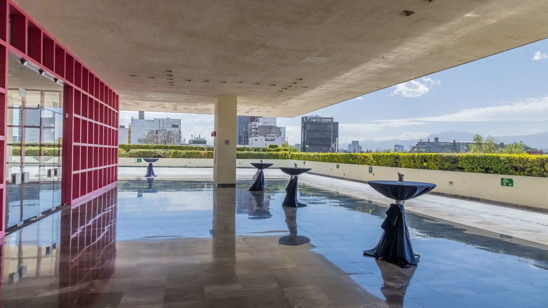 Outdoor Hall Terraza Virreyes featuring tall cocktail tables and views of the city skyline at Camino Real Polanco Mexico