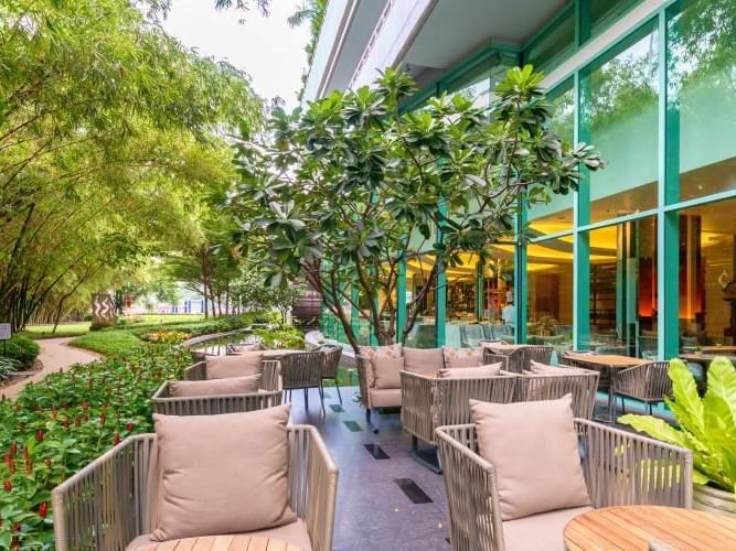 An outdoor lobby lounge area at Chatrium Residence Riverside