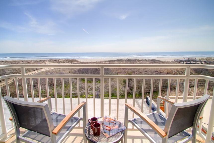 2 chairs set on the balcony overlooking the ocean at our Avalon NJ hotel