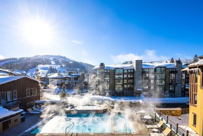 Snowy exterior view of the pool at The Chateaux Deer Valley Resorts