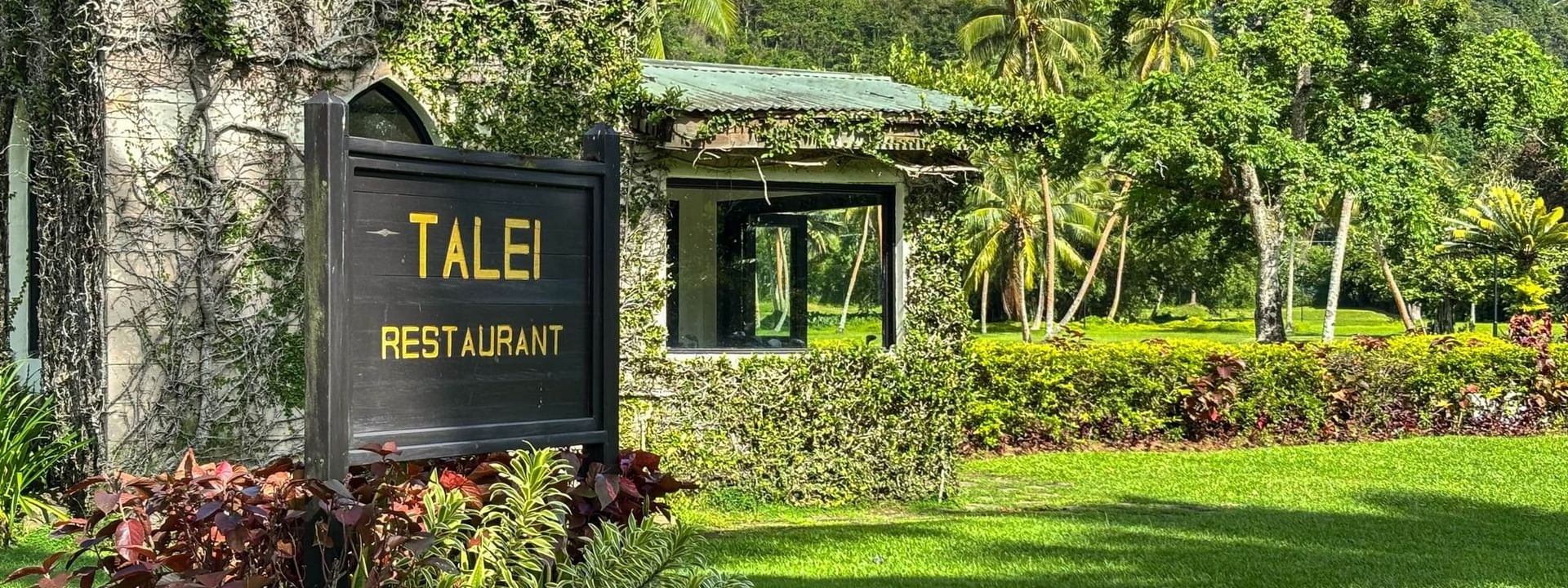 Talei Restaurant sign in lush garden at The Naviti Resort in Korolevu.