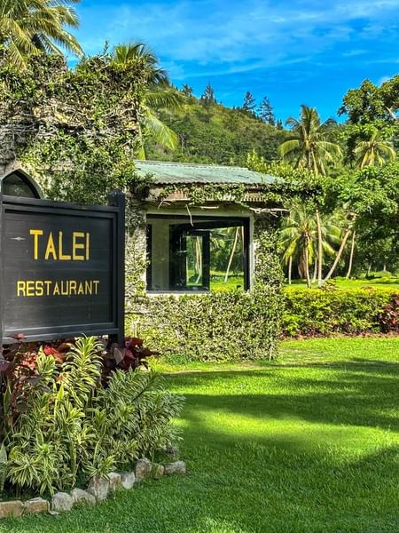 Talei Restaurant sign in lush garden at The Naviti Resort in Korolevu.