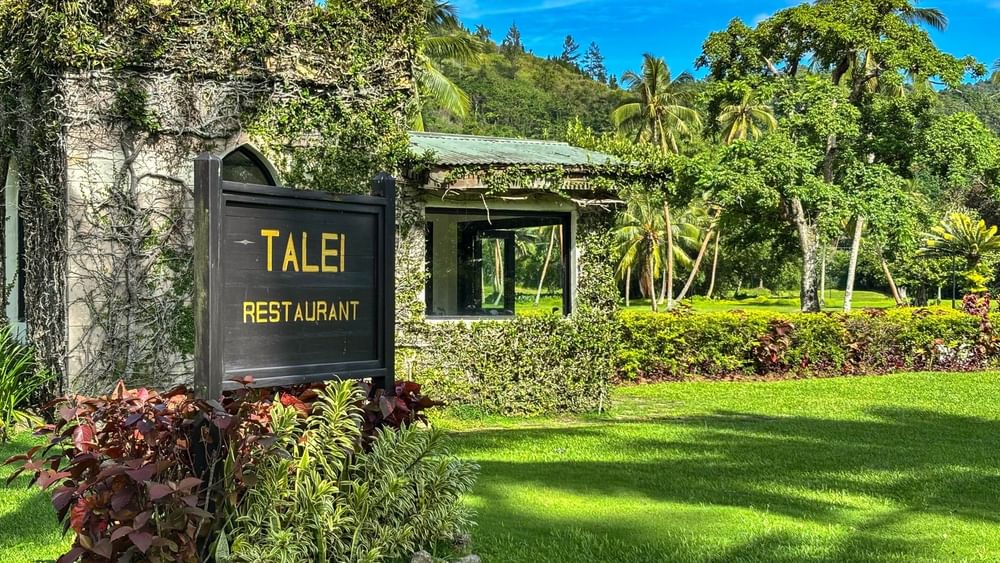 Talei Restaurant sign in lush garden at The Naviti Resort in Korolevu.